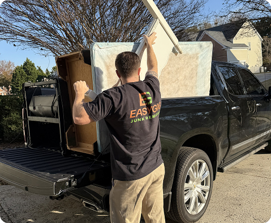 EasyGig hauler loading up a junk removal haul with bulky items