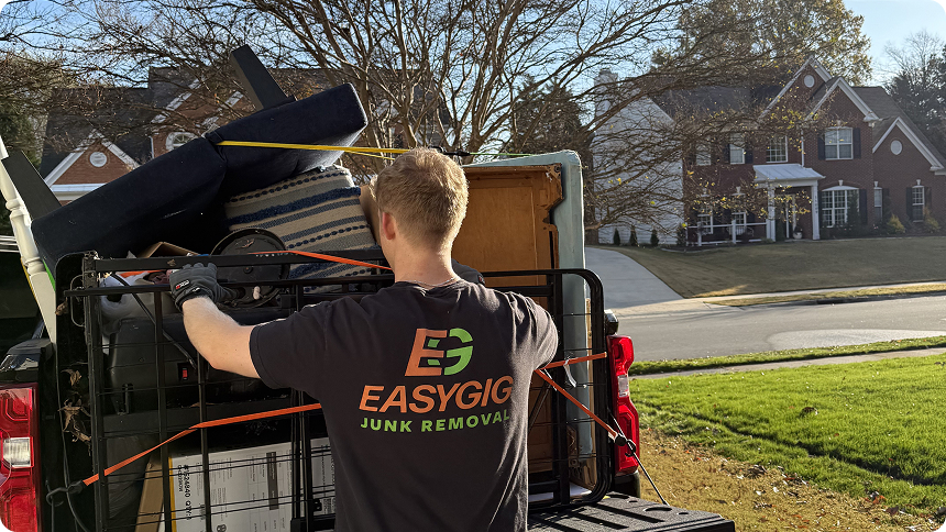 EasyGig Junk Removal Hauler loading up a pickup truck in suburban Charlotte, NC