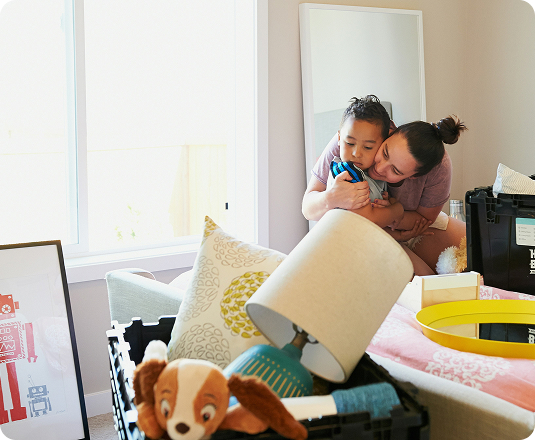 Mom decluttering their child's bedroom.