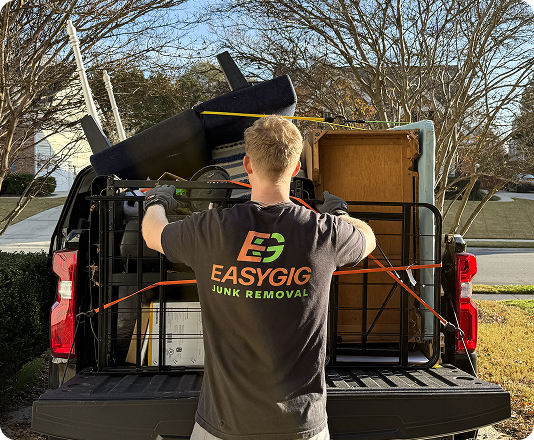 EasyGig Junk Removal Hauler loading up a pickup truck in suburban Charlotte, NC