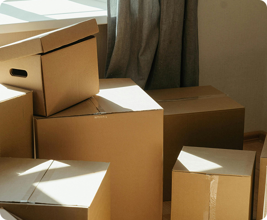 Pile of used moving cardboard boxes ready for junk removal.
