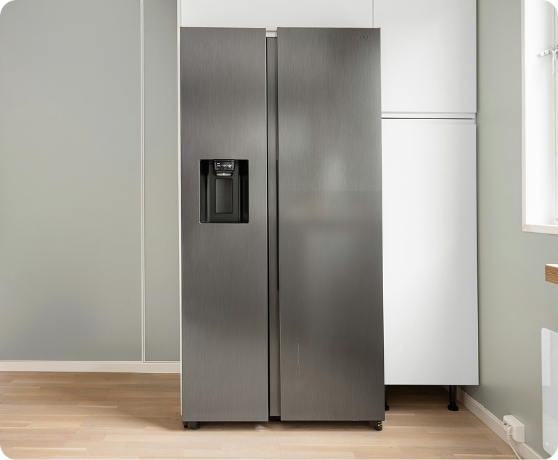 Old refrigerator waiting for junk removal pickup