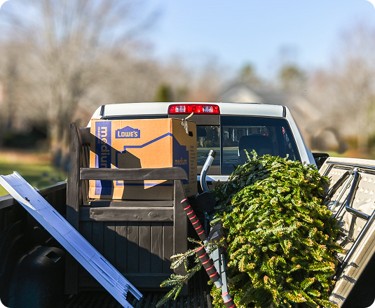 EasyGig Junk Removal pickup truck loaded with junk removal in a Charlotte, NC neighborhood