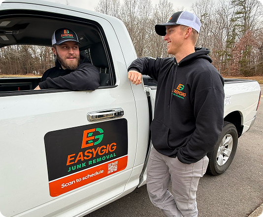 Two EasyGig Junk Removal Haulers talking to each other after a haul.