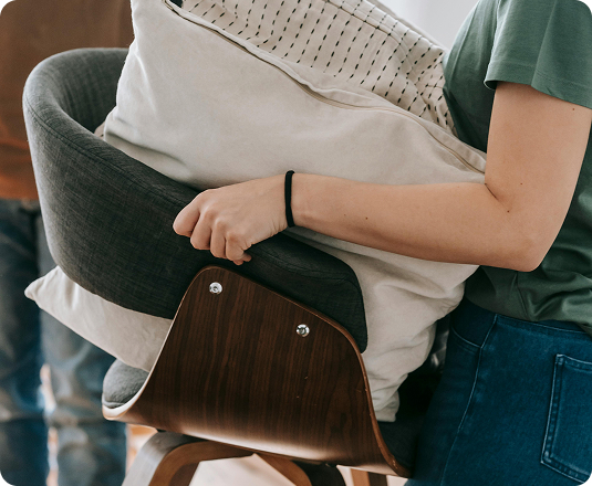 Woman walking her donations to the curb for EasyGig same-day donation pickup.