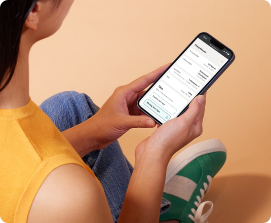 A woman using EasyGig's online booking process for on-demand, fast, and simple junk removal.