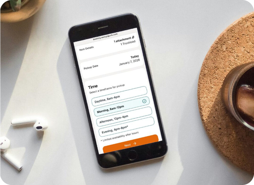 A cell phone with EasyGig Junk Removal's simple booking site for donation pickup.
