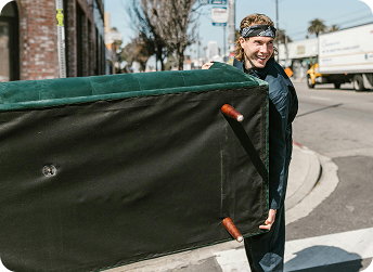 EasyGig Hauler loading a donated couch for the Salvation Army.