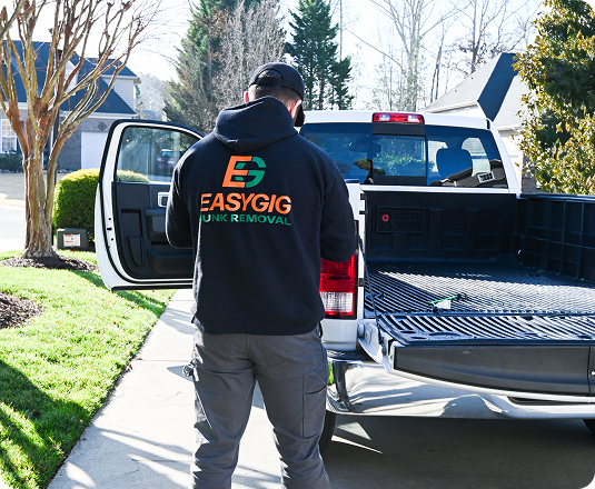 EasyGig hauler readying his pickup truck for a junk removal haul