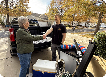 EasyGig Junk Removal Hauler shaking hands with a customer after donation pickup
