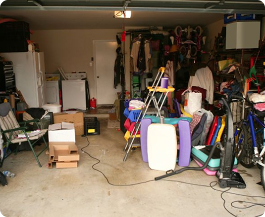 A cluttered garage waiting for an EasyGig Hauler to remove the unwanted items same-day.