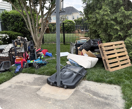 Driveway full of junk ready for same-day pickup with EasyGig