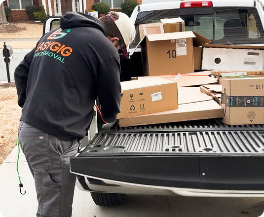 EasyGig hauler loading up a pickup truck with moving cardboard boxes.