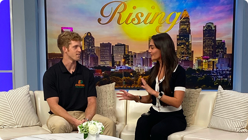 WCCB host Taylor Miller with EasyGig's CEO Brendan Little on set of WCCB's Rising TV segment